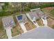 This aerial view shows multiple homes in a neighborhood; one house has solar panels at 108 Pronghorn Deer Ct, Garner, NC 27529
