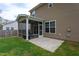 This home's backyard has a screen porch and small patio, and the yard is level and fully fenced at 108 Pronghorn Deer Ct, Garner, NC 27529