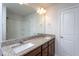 Bathroom features a double sink vanity with granite countertops, dark wood cabinets, and a shower/tub combo at 108 Pronghorn Deer Ct, Garner, NC 27529