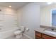 Neutral bathroom featuring a combination shower and tub, along with a granite vanity and tile flooring at 108 Pronghorn Deer Ct, Garner, NC 27529