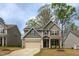 Charming two-story home with solar panels, manicured lawn, and a cozy, inviting feel at 108 Pronghorn Deer Ct, Garner, NC 27529