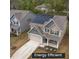 Two-story home boasting solar panels, landscaped yard, and a neutral color palette at 108 Pronghorn Deer Ct, Garner, NC 27529