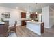 Open concept kitchen with granite island, breakfast bar, and easy access to the adjacent dining area at 108 Pronghorn Deer Ct, Garner, NC 27529