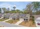 Street view of a two-story house with solar panels and a manicured front yard at 108 Pronghorn Deer Ct, Garner, NC 27529