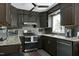 Modern kitchen featuring stainless steel appliances, granite countertops, and custom cabinetry at 1105 Terrace Ct, Raleigh, NC 27615