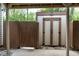Exterior view of a shed with double doors, offering additional storage and backyard access at 1105 Terrace Ct, Raleigh, NC 27615
