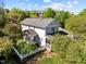 Aerial view of a charming home with a well-maintained yard, mature trees, and inviting outdoor spaces at 119 Weaver Mine Trl, Chapel Hill, NC 27517
