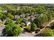An aerial view of a suburban neighborhood showcasing tree-lined streets and well-maintained homes at 119 Weaver Mine Trl, Chapel Hill, NC 27517