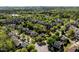 A wide aerial shot of a residential area with neatly aligned homes and green spaces at 119 Weaver Mine Trl, Chapel Hill, NC 27517