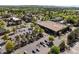 Overhead shot of a retail area, showing a large parking lot, stores, and landscaping at 119 Weaver Mine Trl, Chapel Hill, NC 27517