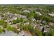 Aerial shot of a residential community, highlighting the lush greenery and neatly arranged homes at 119 Weaver Mine Trl, Chapel Hill, NC 27517