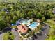 Aerial view of a community pool area, complete with multiple pools, seating, and parking at 119 Weaver Mine Trl, Chapel Hill, NC 27517