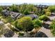 An aerial shot showcases a well-placed home nestled among mature trees in a peaceful neighborhood at 119 Weaver Mine Trl, Chapel Hill, NC 27517