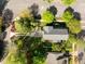 Aerial view of the property, showcasing a well-maintained home with a large yard and mature trees in a suburban setting at 119 Weaver Mine Trl, Chapel Hill, NC 27517