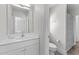 Bright bathroom featuring white cabinets, countertops, stainless steel fixtures and toilet at 119 Weaver Mine Trl, Chapel Hill, NC 27517