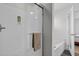 Modern bathroom features a walk-in shower with glass door and towel bar and separate tub at 119 Weaver Mine Trl, Chapel Hill, NC 27517