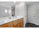 Bathroom with white countertops and natural wood cabinets at 119 Weaver Mine Trl, Chapel Hill, NC 27517