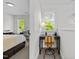 Open landing area with a desk adjacent to a bedroom with large window views at 119 Weaver Mine Trl, Chapel Hill, NC 27517