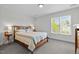 Bedroom with a window and wood-framed bed at 119 Weaver Mine Trl, Chapel Hill, NC 27517