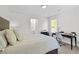 Bedroom with ensuite bath, windows and desk at 119 Weaver Mine Trl, Chapel Hill, NC 27517