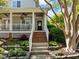 Inviting front entrance with brick steps leading to a covered porch and stylish front door at 119 Weaver Mine Trl, Chapel Hill, NC 27517