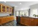 Spacious kitchen with natural wood cabinets, subway tile, and stainless steel dishwasher and appliances at 119 Weaver Mine Trl, Chapel Hill, NC 27517