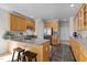 Spacious kitchen with wood cabinets, tile floors, and modern stainless steel appliances at 119 Weaver Mine Trl, Chapel Hill, NC 27517