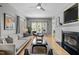 Bright and airy living room with a fireplace, hardwood floors, and ample natural light at 119 Weaver Mine Trl, Chapel Hill, NC 27517