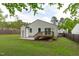 House exterior featuring a spacious lawn and wooden deck providing a beautiful outdoor retreat for entertaining guests at 120 Cabrita Ct, Holly Springs, NC 27540
