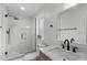 Bathroom featuring glass enclosed shower, vanity with black faucet, and modern fixtures at 120 Cabrita Ct, Holly Springs, NC 27540