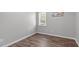 Cozy bedroom with a window and hardwood floors at 120 Cabrita Ct, Holly Springs, NC 27540
