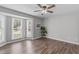 Large bedroom with ceiling fan, hardwood flooring, and bay window at 120 Cabrita Ct, Holly Springs, NC 27540