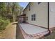 Spacious backyard featuring a concrete patio area with screened porch, ideal for outdoor gatherings at 1211 Yellow Wood Dr, Mebane, NC 27302