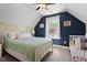 Bedroom with bed, crib, ceiling fan, and large window allowing natural light at 1211 Yellow Wood Dr, Mebane, NC 27302