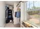 Walk-in closet featuring built-in shelving and a large window for natural light at 1211 Yellow Wood Dr, Mebane, NC 27302