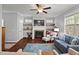 Cozy living room featuring a stone fireplace, built-in shelves, and comfortable seating at 1211 Yellow Wood Dr, Mebane, NC 27302