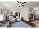 Open-concept living area with hardwood floors, kitchen view, and plenty of natural light at 1211 Yellow Wood Dr, Mebane, NC 27302