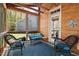 Comfortable screened-in porch offers a relaxing outdoor living space with wood walls and ceiling at 1211 Yellow Wood Dr, Mebane, NC 27302