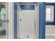 Bathroom featuring a tiled shower and door to a closet with built in shelving at 1211 Yellow Wood Dr, Mebane, NC 27302