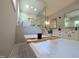 Bright bathroom features a soaking tub with a view of the walk-in shower and dual sink vanity at 1213 Rocky Point Ln, Durham, NC 27712