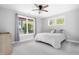 Cozy bedroom with hardwood floor, gray walls, light curtains, and ample natural light at 1213 Rocky Point Ln, Durham, NC 27712