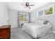 Bright bedroom with carpet, neutral walls and ceilings, and a window offering natural light at 1213 Rocky Point Ln, Durham, NC 27712