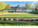 Expansive clubhouse with covered verandas and lush landscaping, perfect for gatherings at 1213 Rocky Point Ln, Durham, NC 27712