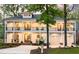Stately two-story home featuring a double porch, a two-car garage, and mature landscaping at 1213 Rocky Point Ln, Durham, NC 27712