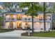 Stunning two-story home featuring a charming wrap-around porch, perfect for relaxing and enjoying the outdoors at 1213 Rocky Point Ln, Durham, NC 27712