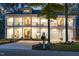 Charming two-story home with inviting front porches and classic design details at twilight at 1213 Rocky Point Ln, Durham, NC 27712