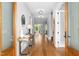 Elegant foyer with hardwood floors, a stylish console table, and abundant natural light at 1213 Rocky Point Ln, Durham, NC 27712
