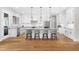 Spacious kitchen boasts a large central island with seating, pendant lighting, and stainless steel appliances at 1213 Rocky Point Ln, Durham, NC 27712