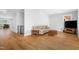 Cozy living room with hardwood floors, a comfortable sofa, and natural light from nearby windows at 1213 Rocky Point Ln, Durham, NC 27712