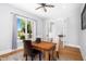 Cozy home office featuring a wood desk, neutral colors, and a view of the lush outdoors at 1213 Rocky Point Ln, Durham, NC 27712